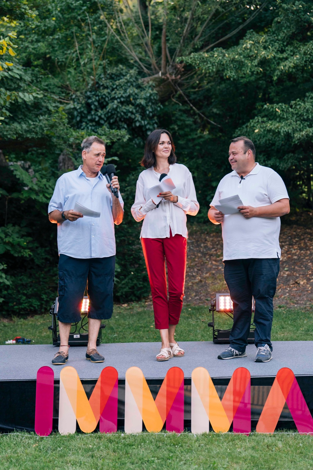 IMMMA outdoor stage event with hosts and big colourful letters, Vienna — event photography by Best Alex Shots