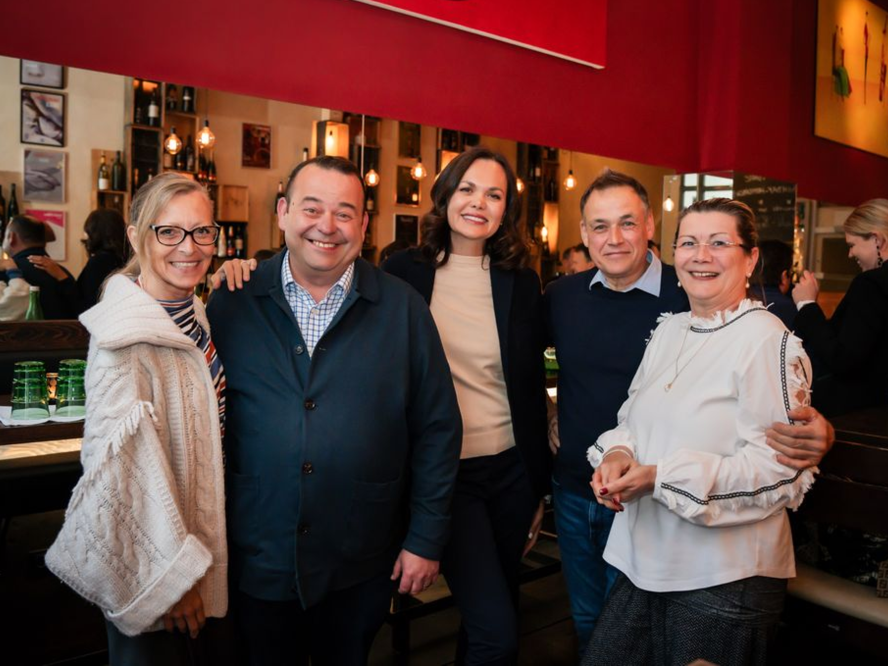 Group portrait at restaurant event, Vienna