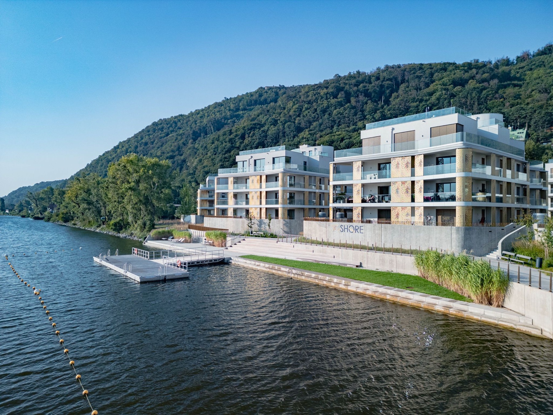 The Shore waterfront development with promenade and dock — drone photo by Best Alex Shots, Vienna